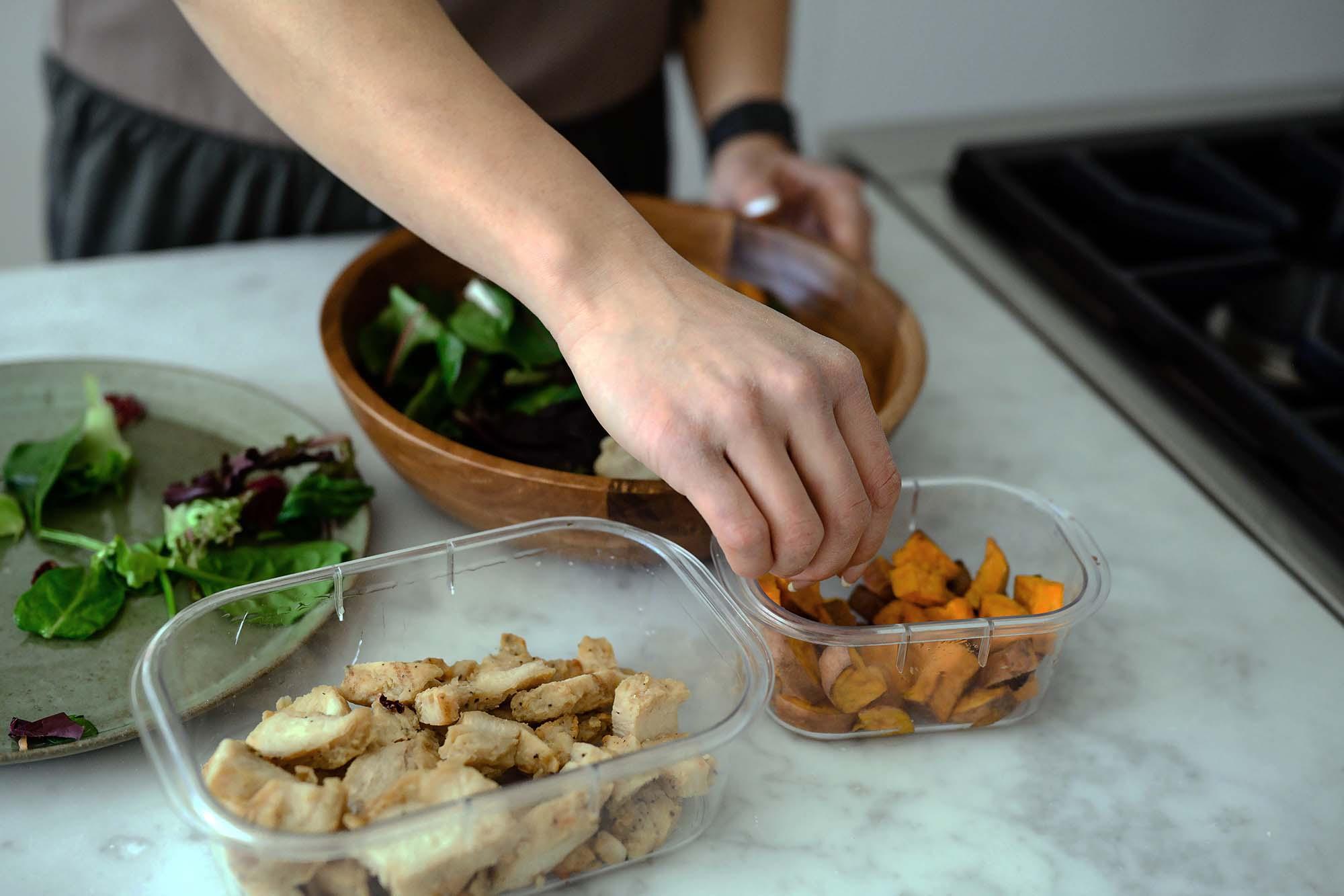 Picture of woman preparing salad in the kitchen